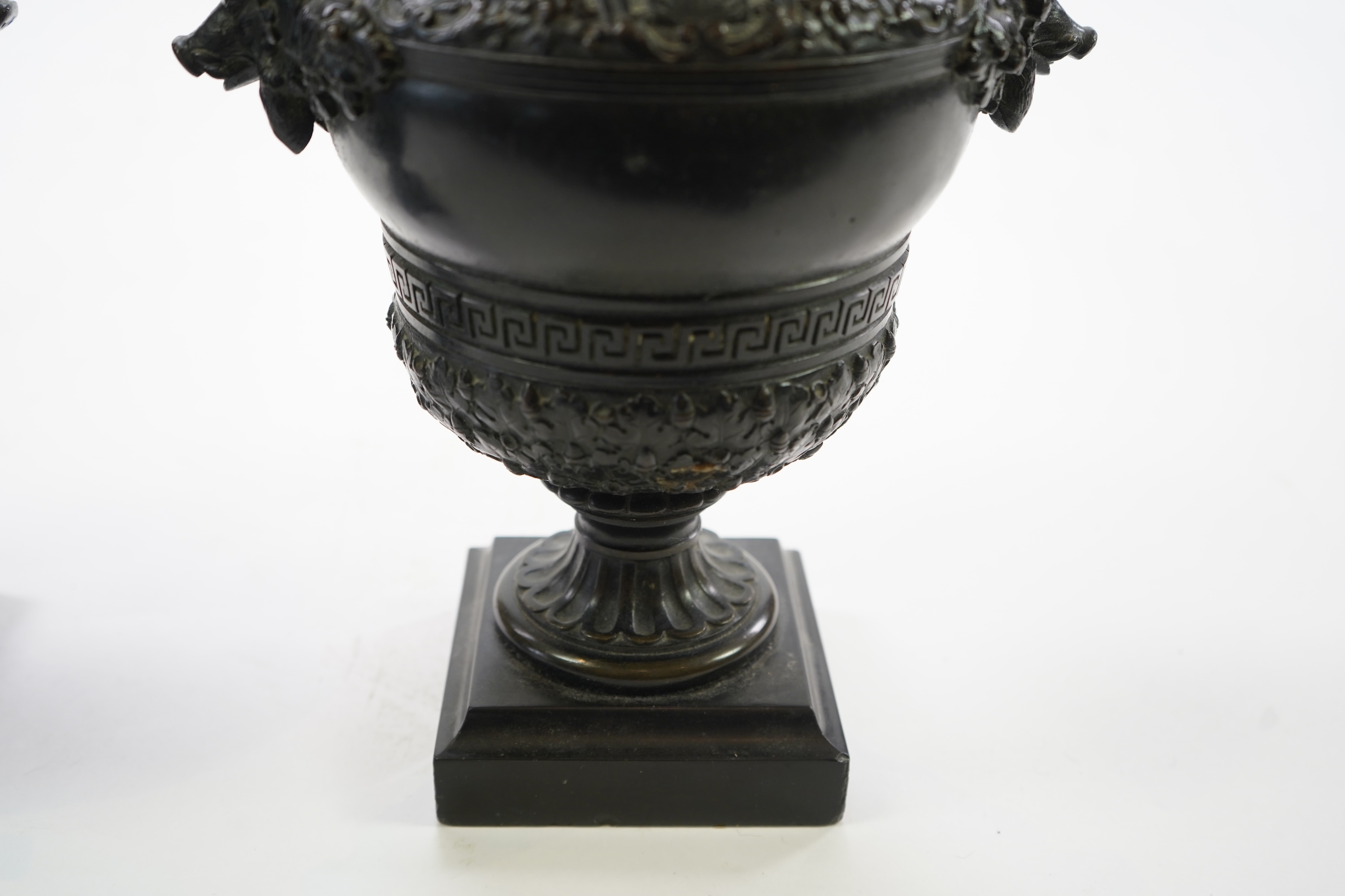 A pair of neoclassical revival bronze urns, late 19th century